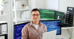 Portrait Of Male Programmer In Office